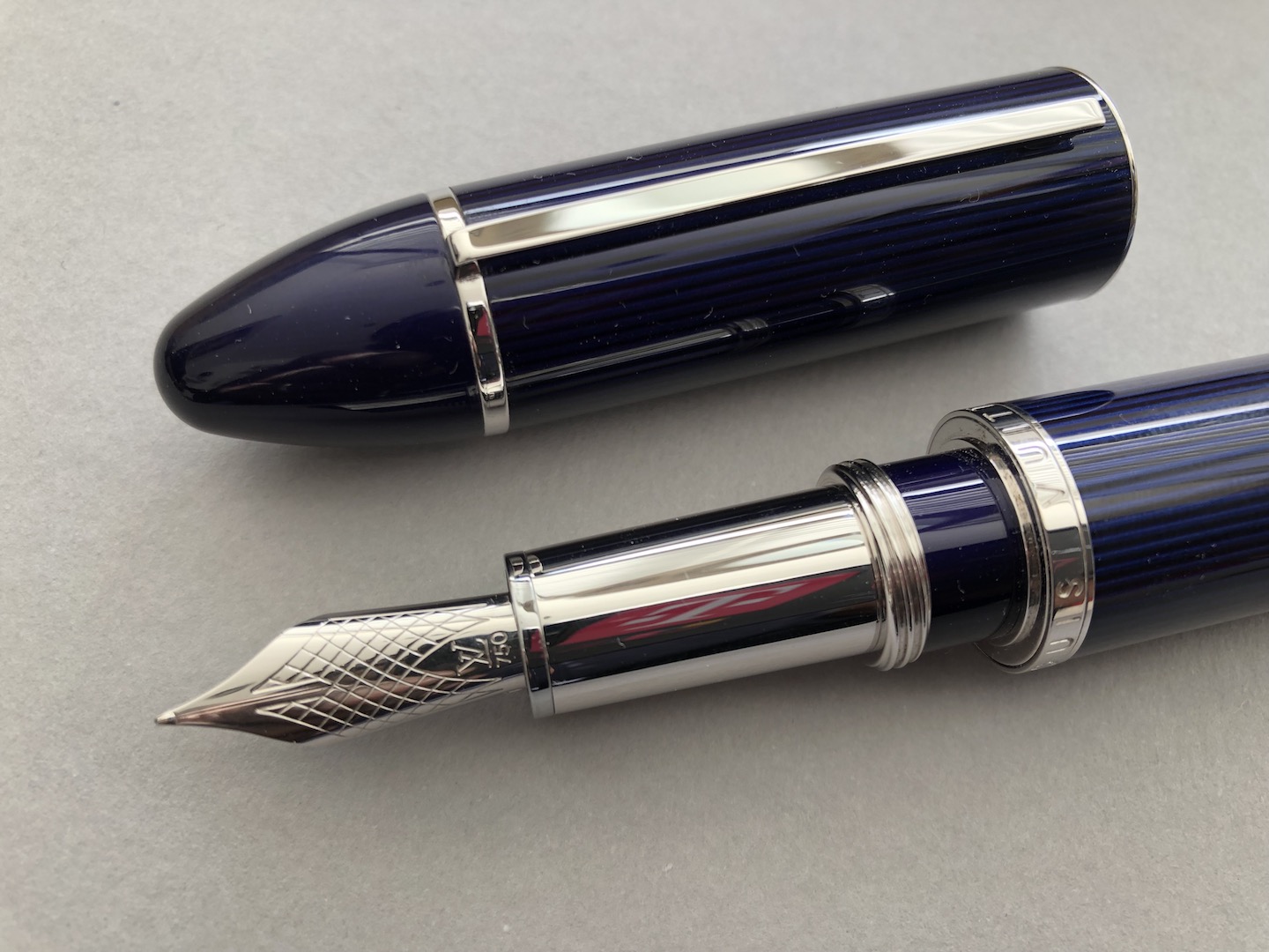 Sold at Auction: Louis Vuitton, LOUIS VUITTON FOUNTAIN PEN CARGO  COLLECTION. IN BLUE LACQUER WITH BLACK STRIPES AND PLATINUM PLATING DETAILS.